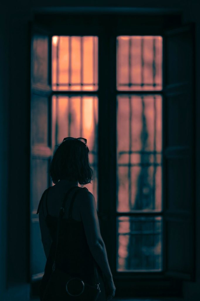 Woman looking out the window.
